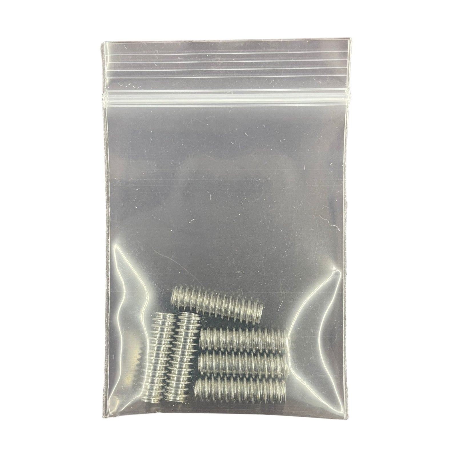 Ein kleiner durchsichtiger Ziplock-Beutel mit sechs Rapid Surf Shop Finnenschrauben-Set (6 Stück), ordentlich in zwei Reihen angeordnet. Perfekt für FCS Finnenboxen und Surfboard-Setups. Abgebildet auf einfarbig weißem Hintergrund.
