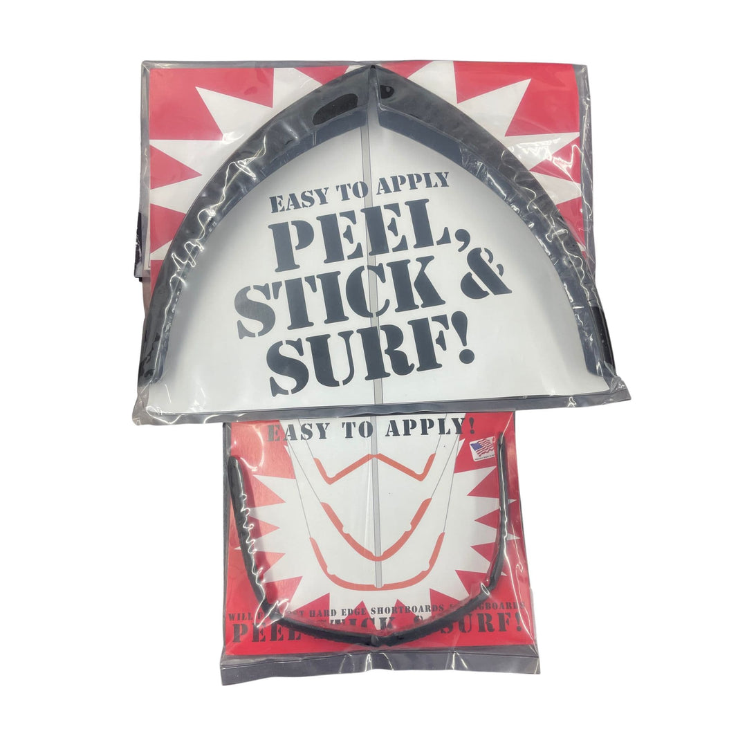 Ein verpacktes Surfboard Guard Bundle (groß) von Rapid Surf Shop trägt die Aufschrift "Easy to Apply PEEL, STICK &amp; SURF!" in Schwarz auf Weiß mit einem roten Design, ideal für Longboards. Eine weitere ähnliche Verpackung ist teilweise darunter zu sehen.